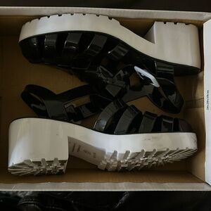 Like new plastic shoes. They are a size 5 and have only been worn once.